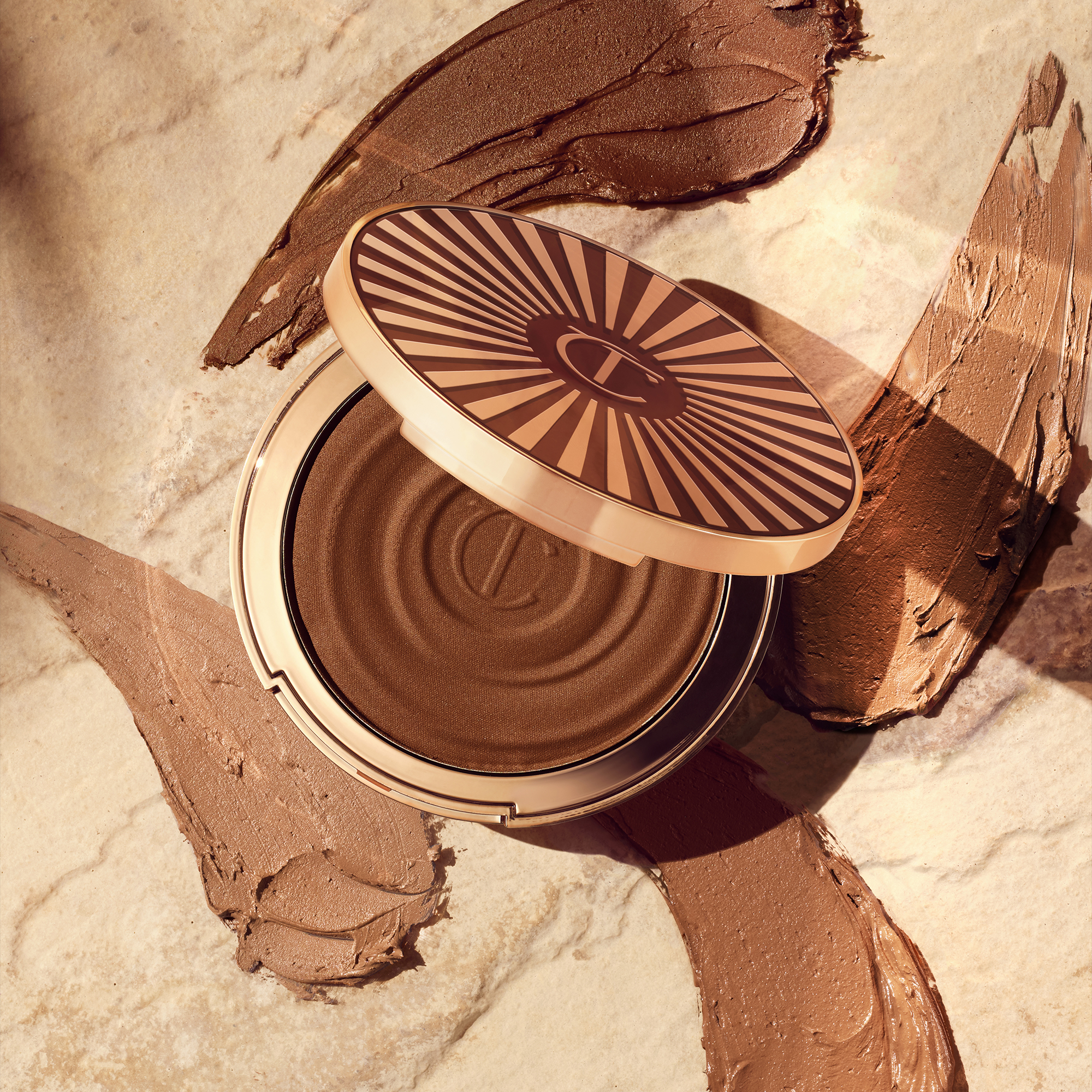 Disney 100  x Charlotte Tilbury limited-edition Charlotte's Magic Cream with Tinkerbell design on night sky backdrop