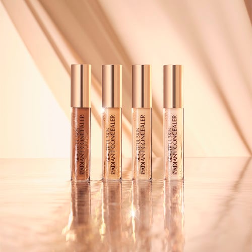 Disney 100  x Charlotte Tilbury limited-edition Charlotte's Magic Cream with Tinkerbell design on night sky backdrop