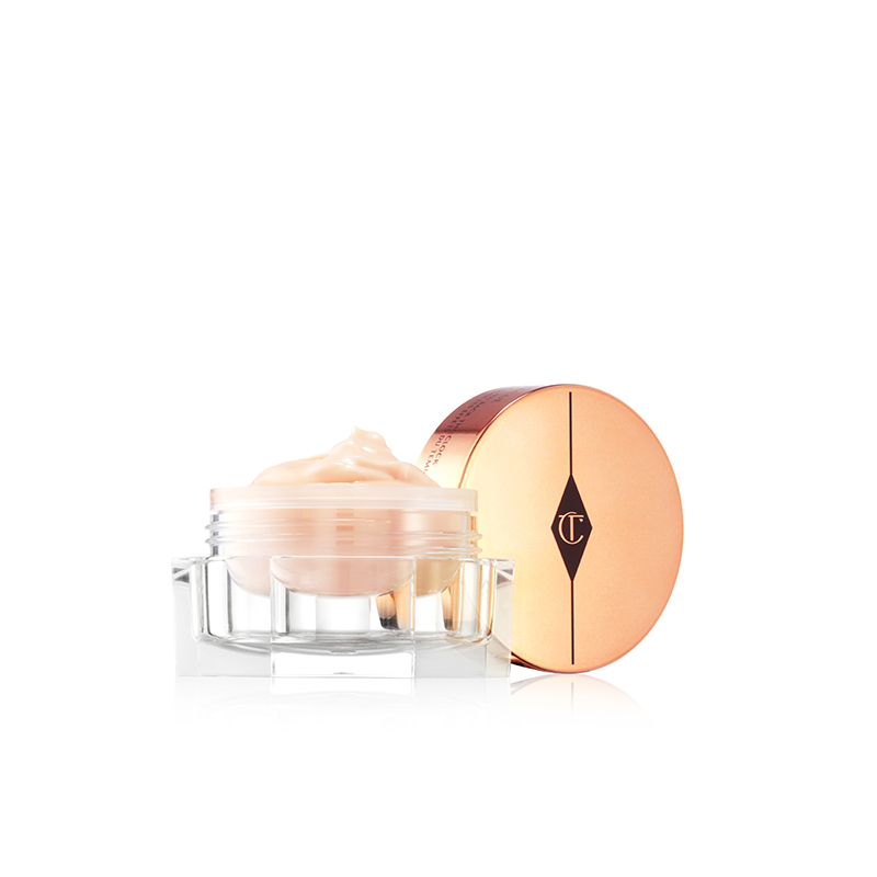 Disney 100  x Charlotte Tilbury limited-edition Charlotte's Magic Cream with Tinkerbell design on night sky backdrop