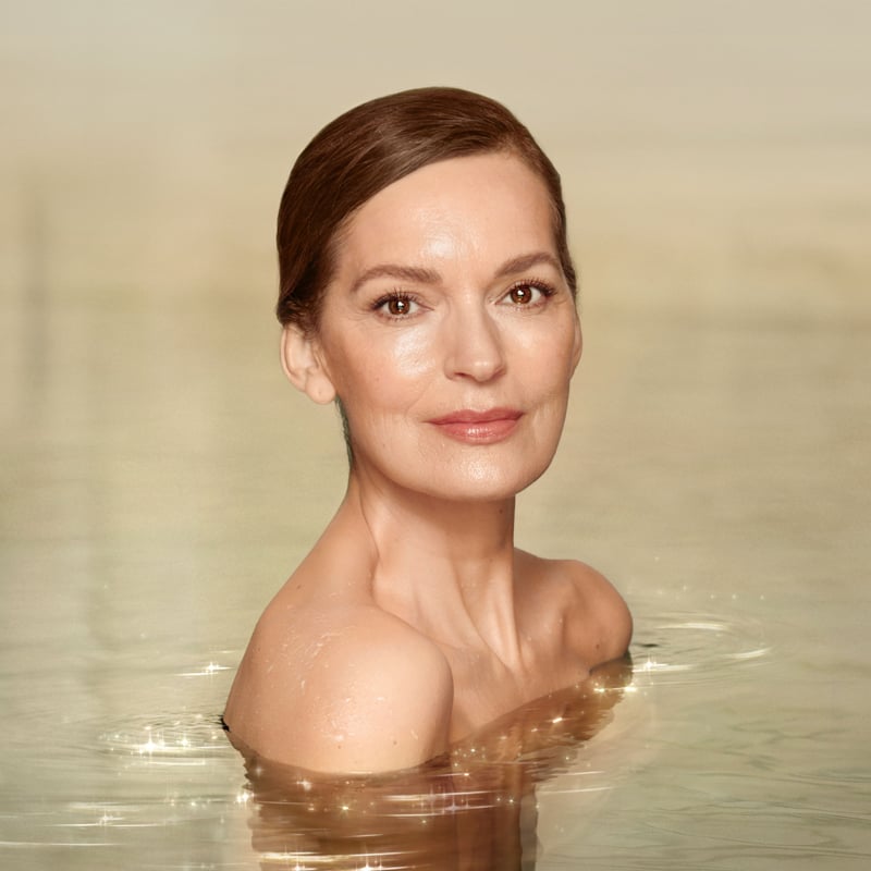 British actress Lily James applying Charlotte's Magic Serum Crystal Elixir for gorgeous, glowing, hydrated skin