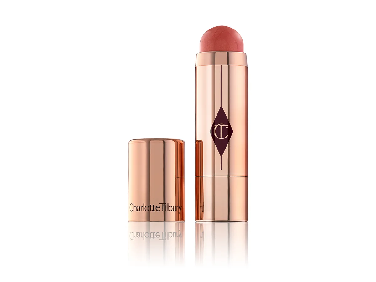 Charlotte's Beach Stick in Moon Beach, a peachy cream blush